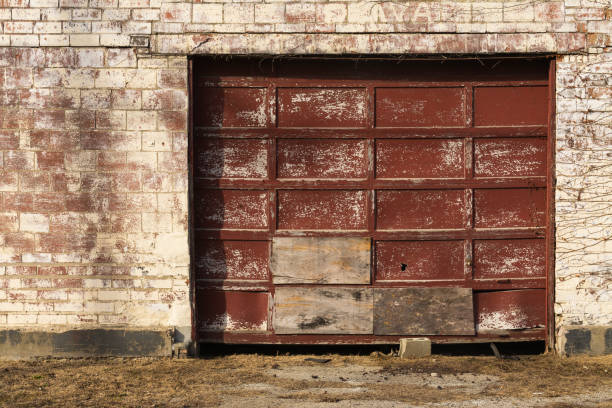 istock Old garage door and brick wall 1098150676
