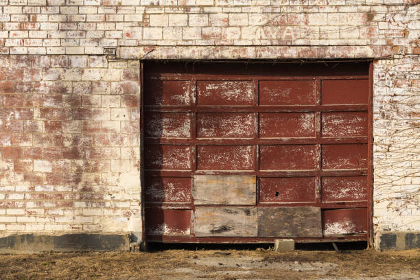 istock Old garage door and brick wall 1098150728