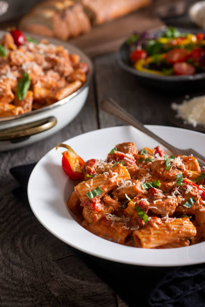 Chicken Riggies Rigatoni with Chicken and Marinara Sauce (Chicken Riggies) cooked selective focus vertical pasta stock pictures, royalty-free photos & images