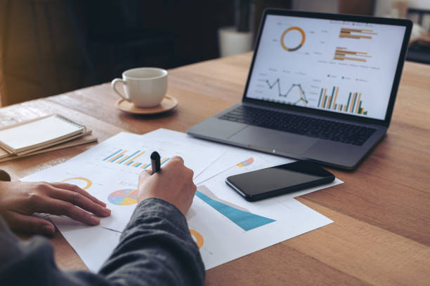 istock A businesswoman writing and working on business data 1098150798