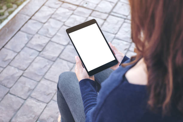 istock a woman holding black tablet pc with blank white screen 1098151912
