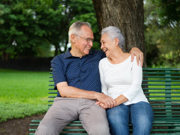 istock Senior couple laughing and hugging 1098154070