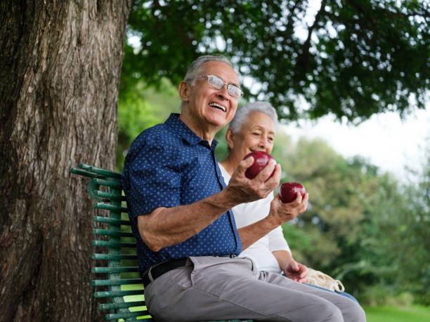 istock Healthy senior couple eating fruit 1098154096