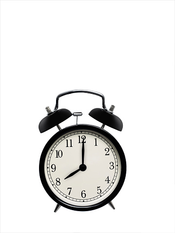 retro alarm clock showing 8 o'clock
