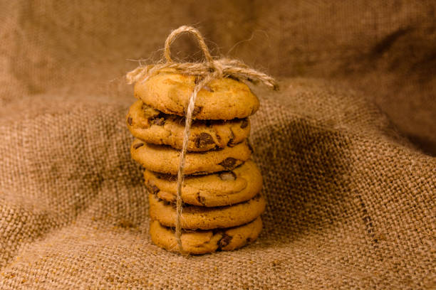 istock Stack of the chocolate chip cookies on sackcloth 1098163678
