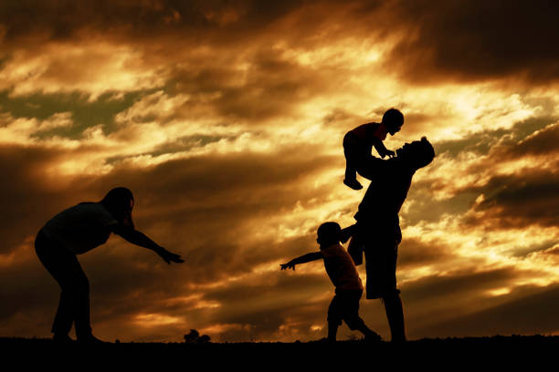 istock Happy family with silhouettes. 1098173050