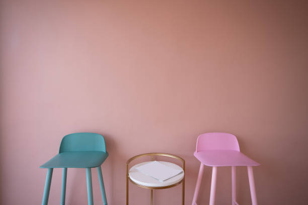 istock Setting of green and pink high stools with high side table on pink background wall / cozy interior conept / pink wall decoration 1098175124
