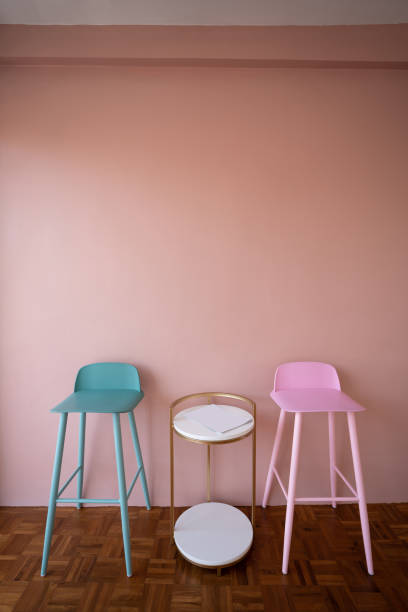 istock Setting of green and pink high stools with high side table on pink background wall / cozy interior conept / pink wall decoration 1098175130
