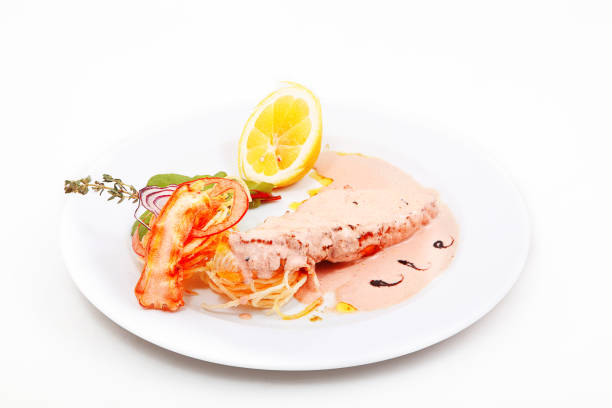 istock Salmon with sauce, lemon and dried tomatoes 1098188318