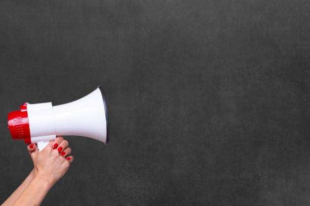 istock Person holding a megaphone or loud hailer 1098188672