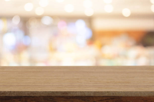 istock Perspective empty white wooden table on top over blur background, can be used mock up for montage products display or design layout. 1098190838