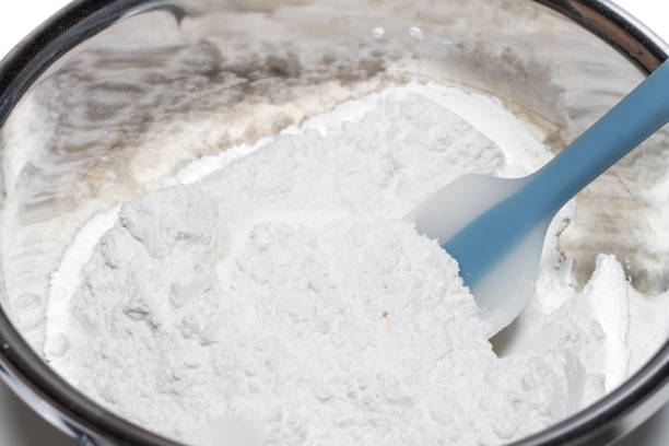 Closeup flour in stainless steel bowl for ingredient mixing