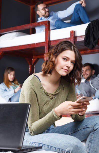 istock Smiling young woman with phone 1098195288