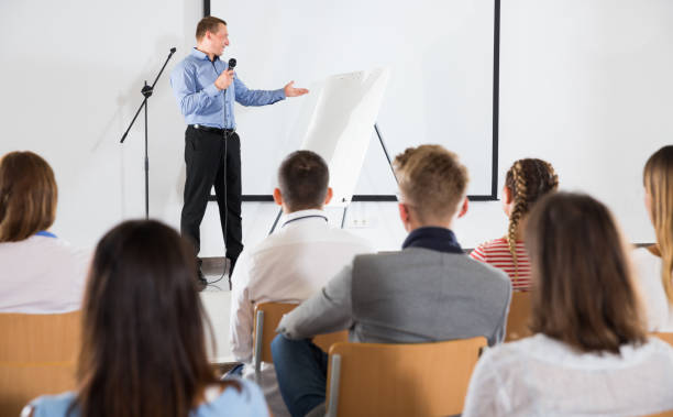 istock Male teacher lecturing to students 1098199902