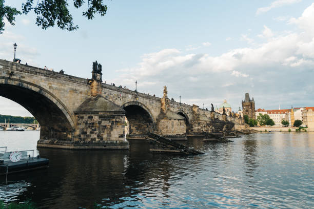 istock Charles Bridge in Prague against sky at sunrise 1098203186
