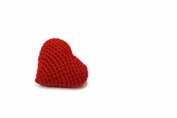 istock Red knitted heart isolated on white background 1098206278