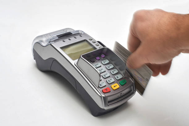 istock Businessman using payment terminal to pay with credit card. 1098209228