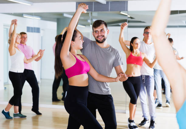 istock smiling young adults dancing salsa 1098211902