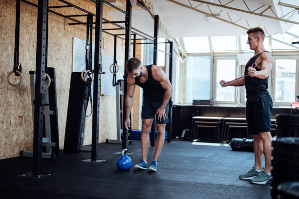 istock Friends working out in a gym 1098211978