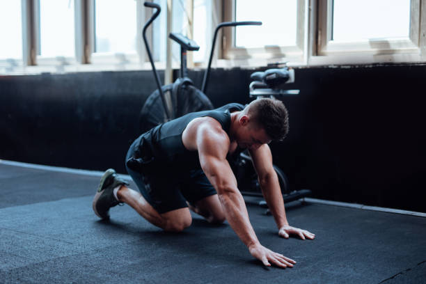 istock Man doing push ups in the gym 1098212098