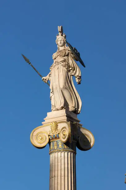 Amazing sunset view of Athena statue in front of Academy of Athens, Attica, Greece