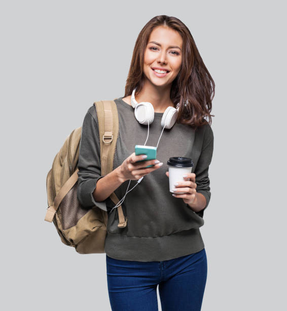 istock Happy young student girl using smart phone 1098214600