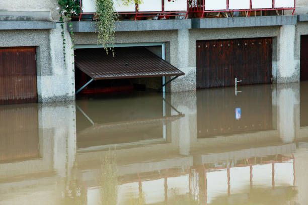 istock Flooded house with open garage doors 1098217202