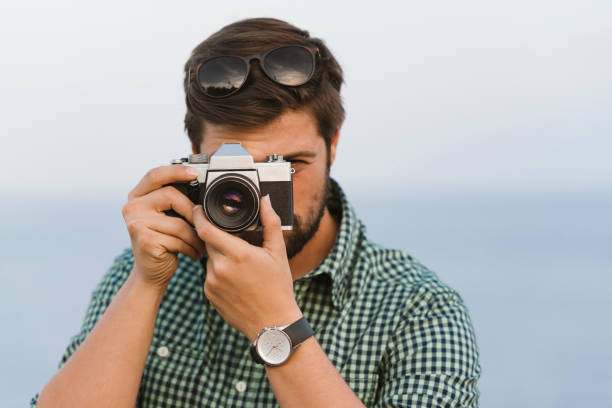 istock Photographer taking picture outdoors 1098217788