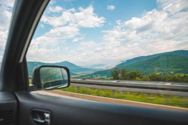 Balderschwang, Germany - July 11, 2015: Traffic in sidemirror on road A09 in Oberallgäu. Valley of Balderschwang. Bavaria, Germany.