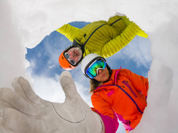 istock mountain rescue team helping hand avalanche vivtim 1098220766