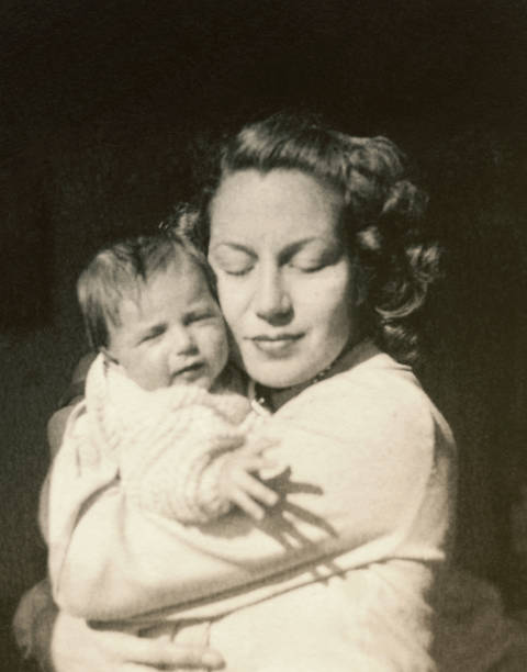 Young mother with her baby in 1948 stock photo