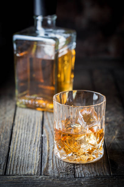 istock Glass and a bottle of whiskey 1098225982