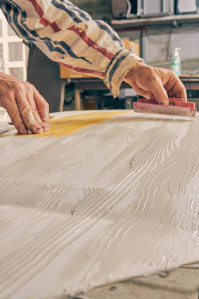 istock Artist using paint brush for making artificial wood texture. 1098226416