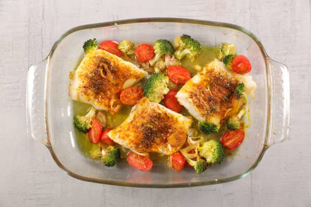 istock baked fish with spice and vegetable 1098227100