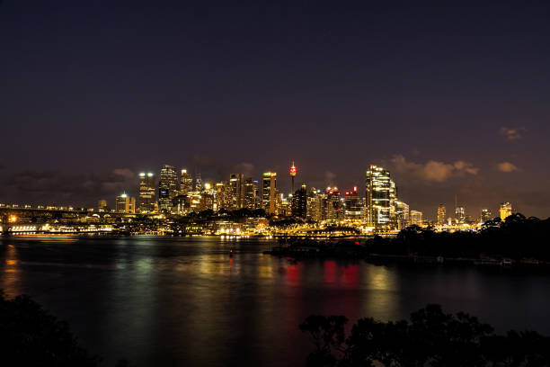 istock generic modern cityscape with water reflection in night 1098233824