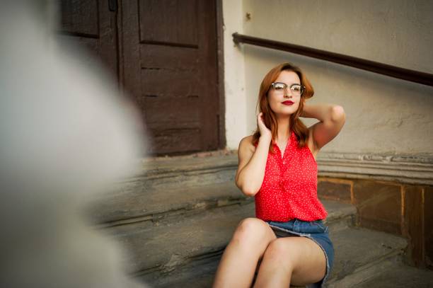 istock Attractive redhaired woman in eyeglasses 1098237090
