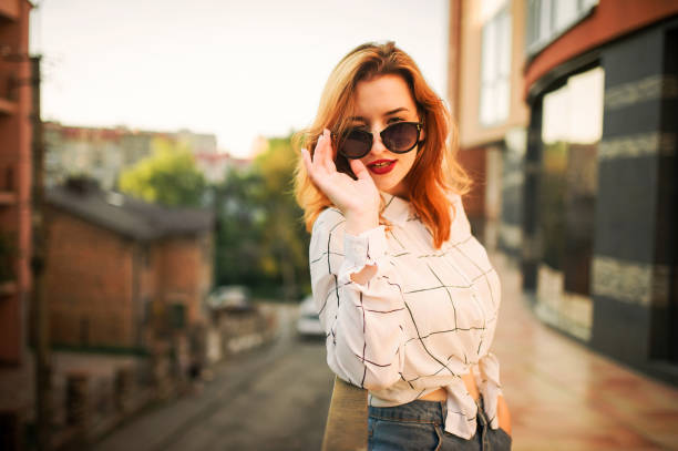 istock Attractive redhaired woman in eyeglasses 1098237630