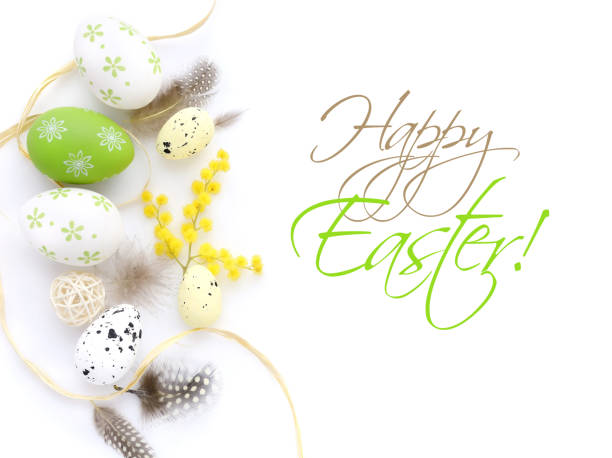 istock Easter eggs and mimosa flowers on white background with space for your text. Top view. 1098240092