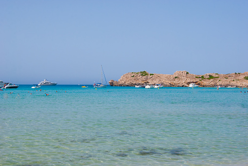 Rocky promontory seen from the beach of the spanish island