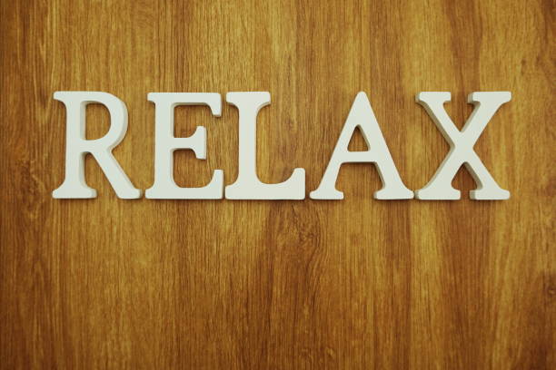 istock Relax alphabet letters on wooden background 1098240584