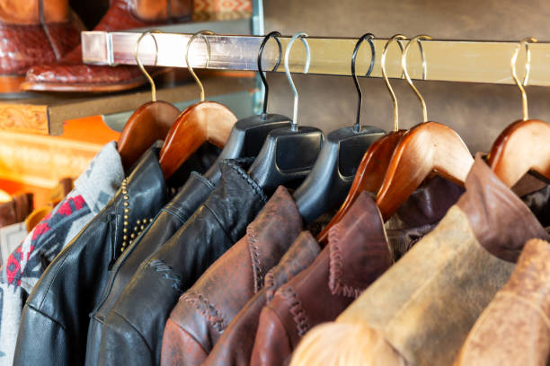 istock Leather jacket on hangers on a rack in retail store, aligned 1098243958