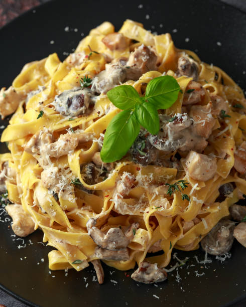 istock Pasta with shiitake mushrooms and chicken with herbs and cheese 1098246494