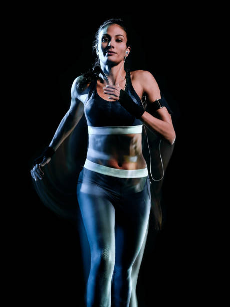 istock beautiful woman runner jogger jogging running isolated black background 1098247144