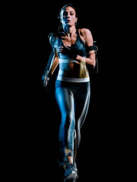 istock beautiful woman runner jogger jogging running isolated black background 1098247308