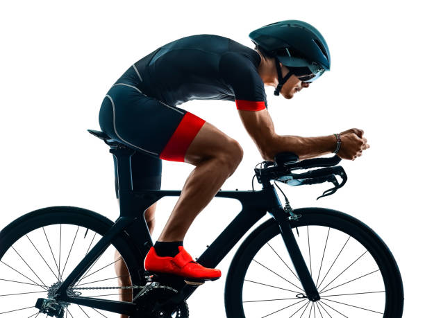 istock triathlete triathlon Cyclist cycling silhouette isolated white b 1098249894