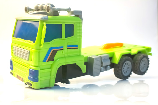 truck broken wheel car toy child lorry green close up with white background