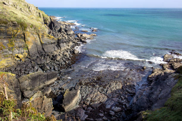 istock Rock Formations and blue cloudy summer sky and Sea, Cornwall 1098251224