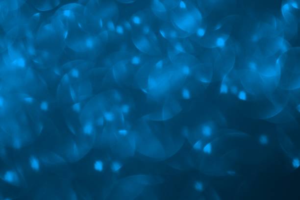 istock light blue many falling sparkles one color bokeh texture - wonderful abstract photo background 1098251596