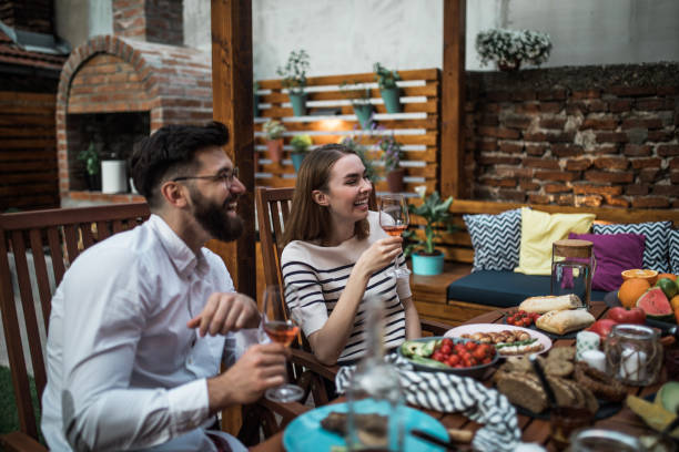 istock Happy friends eating outdoors and having fun 1098253190