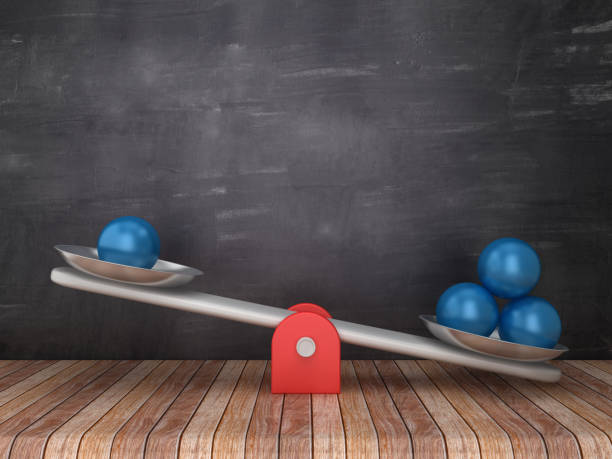 istock Seesaw Scale with Spheres on Chalkboard Background - 3D Rendering 1098253794